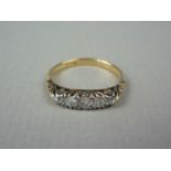 An early 20th Century five stone diamond ring, having a graded arrangement of brilliant cut