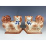 A pair of late 19th / early 20th Century Bo'ness or Staffordshire spaniels, 17 cm high