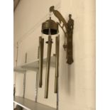 A set of Victorian brass wind chimes, the bracket support modelled as a parrot