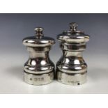 An Elizabeth II silver matched salt and pepper mill pair, of baluster form, M C Hersey and Son,
