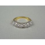 A diamond half hoop eternity ring with 18ct gold shank