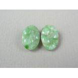 A pair of 1920s clip-on carved jade earrings, the backs stamped SILVER, 15 x 11 mm