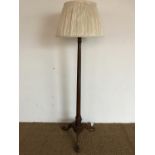 A George V walnut tripod standard lamp