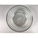 A pressed and cut glass fruit set, the base of the serving bowl bearing the image of a classical
