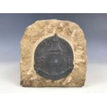 A Second World War Portland stone souvenir letter holder with applied lead boss made from