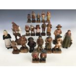 A collection of Black Forest type German and Italian novelty figural wood carvings, depicted in