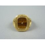 An 18ct gold ring watch by Bueche Girod, having Swiss made crown winding movement and tiger's eye