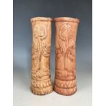 A pair of First World War German prisoner of war work carved bone candlesticks or spill vases