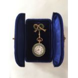 An Edwardian lady's gilt white metal fob watch with brooch suspender, having Swiss made crown-