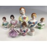 Eight vintage continental porcelain pin-cushion ladies modelled as debutants