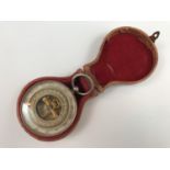 A late 19th Century French pocket aneroid barometer, in fitted case