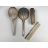 A George VI silver dressing table mirror and brush set, comprising hand mirror, hair brush,