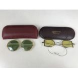 A pair of late 19th Century folding sunglasses retailed by Brown & Co Ltd of Ceylon, in fitted case,