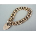 A late Victorian rose coloured yellow-metal curb link bracelet with heart shaped padlock clasp, with
