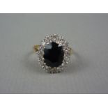 A vintage sapphire and diamond dress ring, with central oval cut sapphire measuring approximately 10
