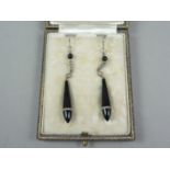 A pair of Art Deco diamond and onyx ear pendants, in a fitted presentation case