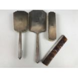 A George VI silver dressing table mirror and brush set, comprising hand mirror, hair brush,