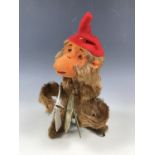 A mid 20th Century clockwork automaton toy monkey playing the cymbals, 16 cm, with lower stage of