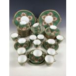 An extensive and fine porcelain tea service, comprising 17 cups, 17 saucers, 12 tea plates, two cake