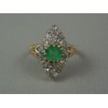 A considerable emerald and diamond dress ring, the square-cut emerald of approx .8 ct claw-set above