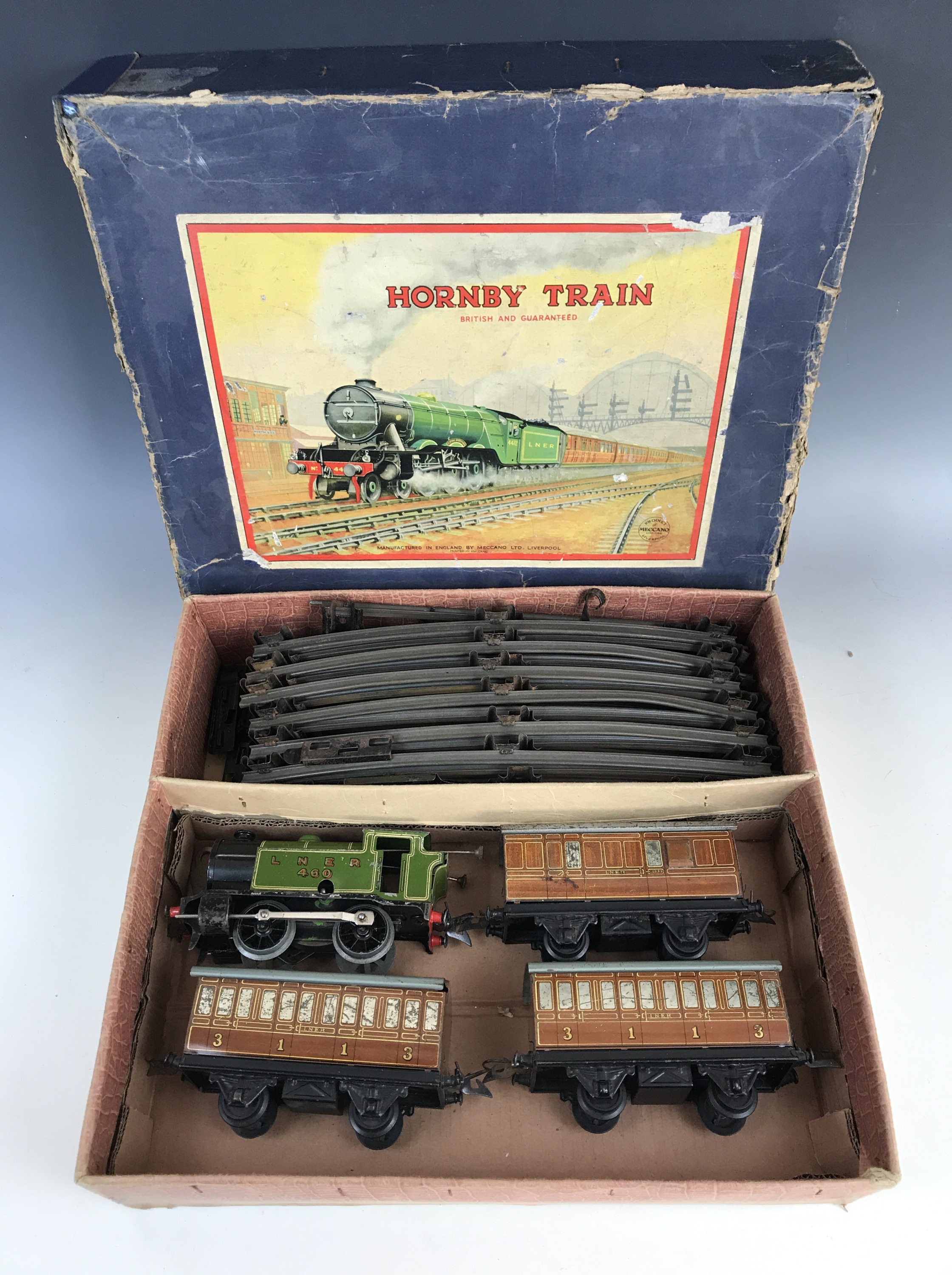 A Hornby clockwork O Gauge passenger train set, having 460 LNER 0-4-0 locomotive in racing green,