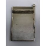 A George VI silver aide memoir, with engine turned decoration to the cover and containing a