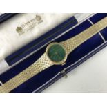 A lady's 14ct gold cased Rolex wristwatch, having crown wound movement and circular malachite dial