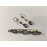 An amethyst and white sapphire demi-parure, comprising bar brooch set with alternate oval-cut stones