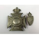 A Victorian Malta Police helmet plate together with an early 20th Century Malta Police helmet or cap