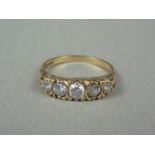 A vintage five stone diamond ring, the brilliant cut diamonds being sunken and pellet set in a