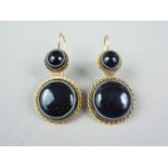 A pair of Victorian yellow metal and bull's eye agate ear pendants, each comprising two rub- and