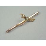 An early 20th Century split seed pearl and yellow metal dragonfly brooch, the insect having a gem