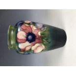 A William Moorcroft Anemone pattern vase, of slender and inverted baluster form, signed and