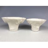 Two Kangxi Chinese blanc-de-chine libation cups, in imitation of rhinoceros horn, with applied