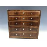 A 19th Century mahogany collectors' chest of drawers, having mahogany cross banded and satinwood