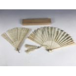 An early 20th Century Japanese painted silk fan having carved bone guards, (a/f), together with a