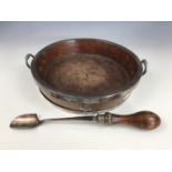 A late 19th Century electroplate mounted oak cheese board and stilton scoop, the former of