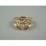 An early 20th Century gentleman's diamond ring, the brilliant cut stone of approximately .16ct, claw