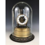 An early 20th Century Eureka electric clock, number 3469, 23 cm, under glass dome on ebonized