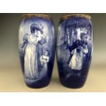 A pair of Royal Doulton vases, of slender inverted baluster form, decorated with sentimental figural