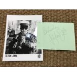 [Autographs / Elton John] Signed loose leaf of paper together with a black and white promotional