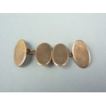 A gentleman's pair of 9ct gold cuff links, of oval shape with chamfered rim, 5.4g