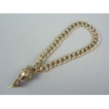 A 9ct gold curb link bracelet with tasselled bauble clasp, 13.2g