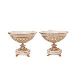 White and gilt porcelain pair centrepieces