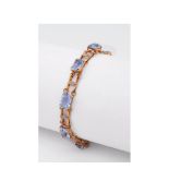 Gold, white gold and synthetic blue topaz bracelet