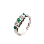 White gold, emeralds and diamonds ring