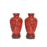 Carved red lacquer pair of vases