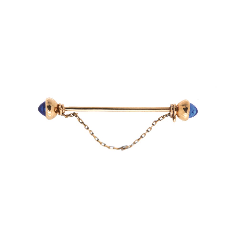 Gold and similar blue sapphire needle brooch