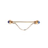 Gold and similar blue sapphire needle brooch