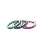 White gold, emeralds, rubies and blue sapphires rings set